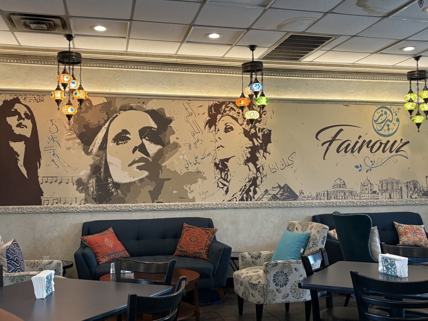 Inside Fairouz, with the Fairouz mural and Turkish mosaic lamps